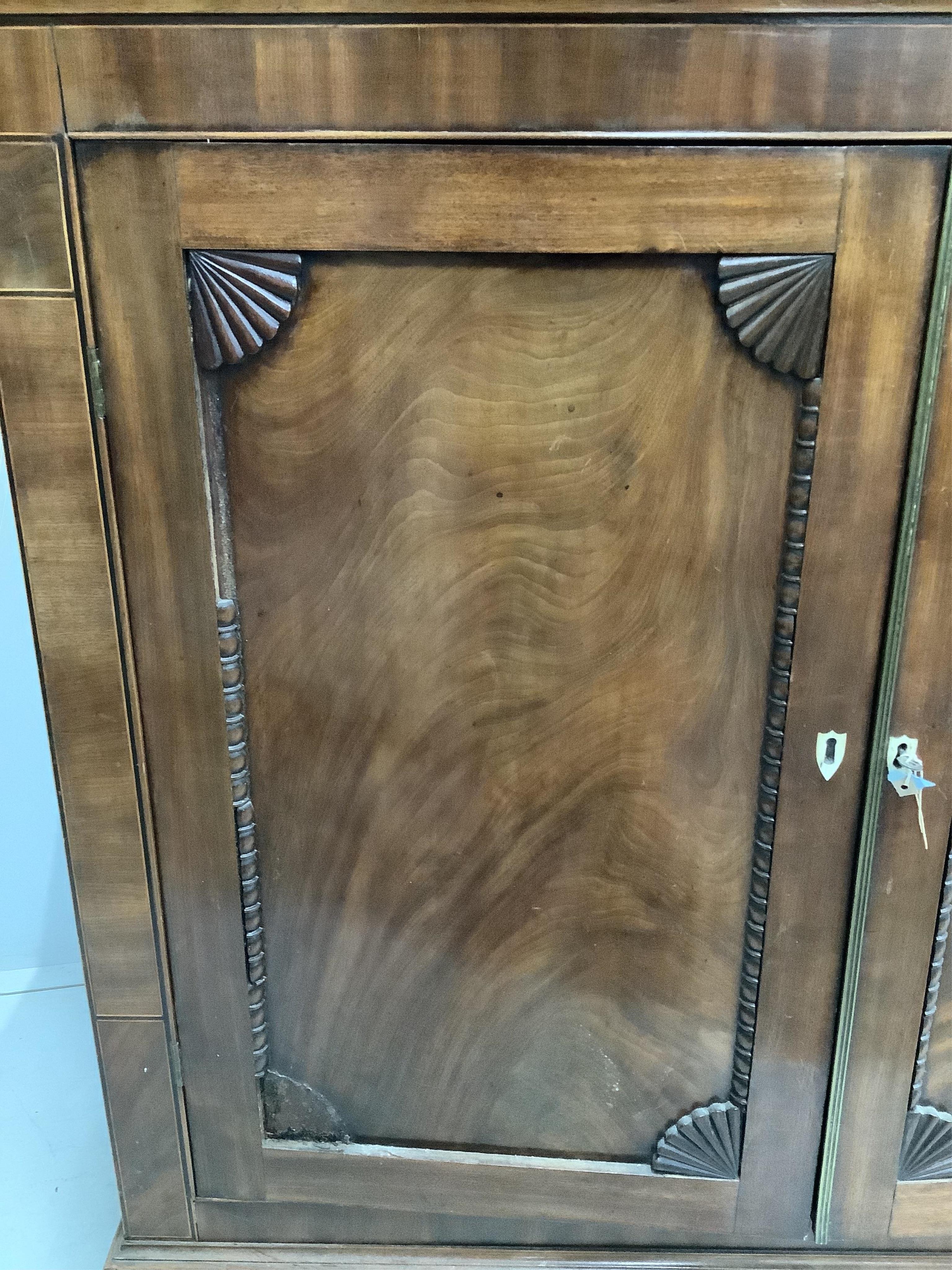 An early Victorian mahogany side cabinet, with bone escutcheons, width 118cm, depth 36cm, height 111cm. Condition - poor to fair